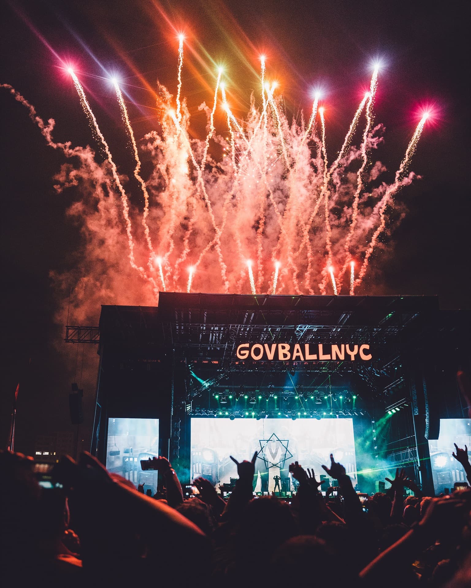 Tool performing live on stage with dramatic lighting