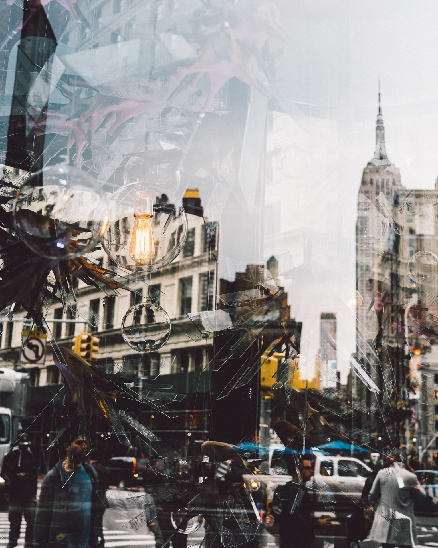 NYC street scene reflected in storefront window